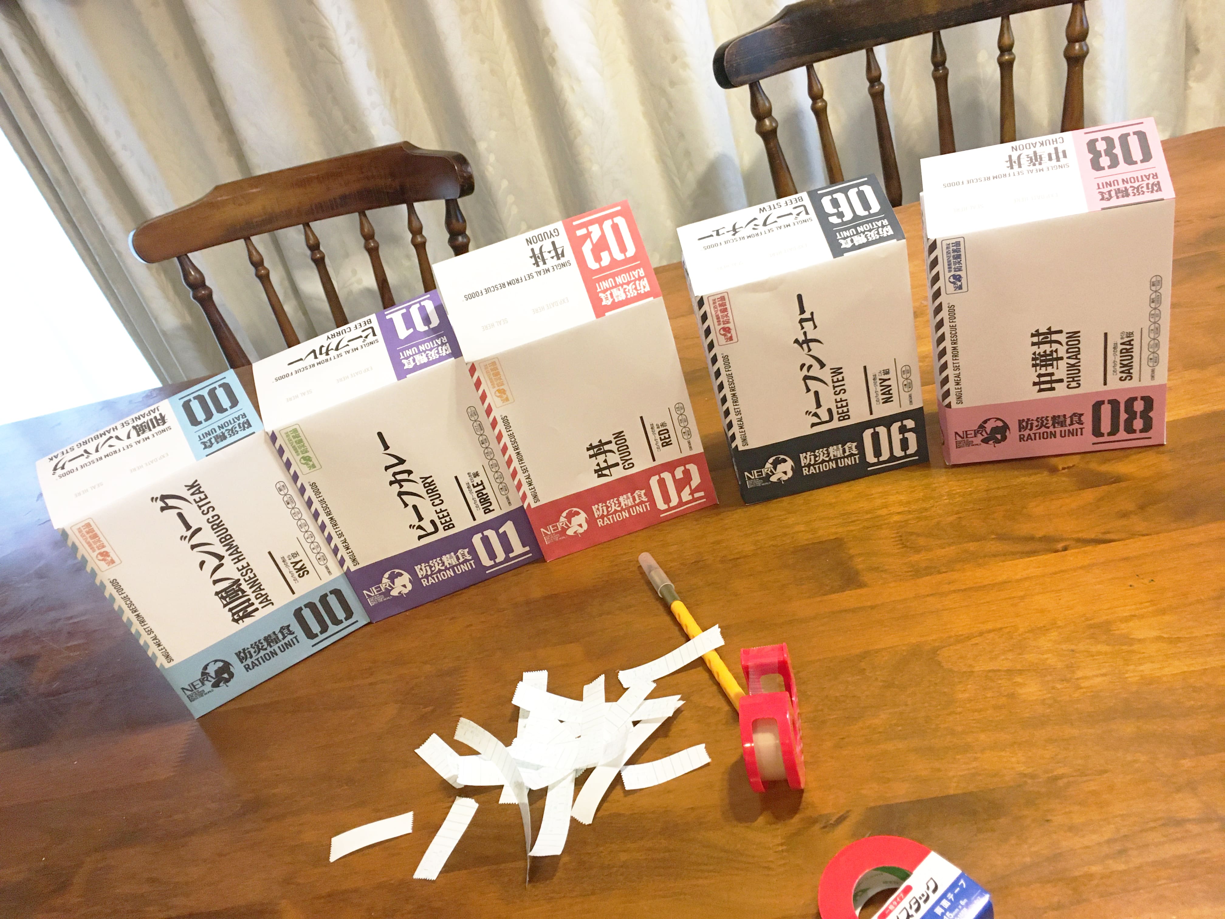 Early packaging prototypes being crafted to look like each of the Eva units (photo by Sakuragi)